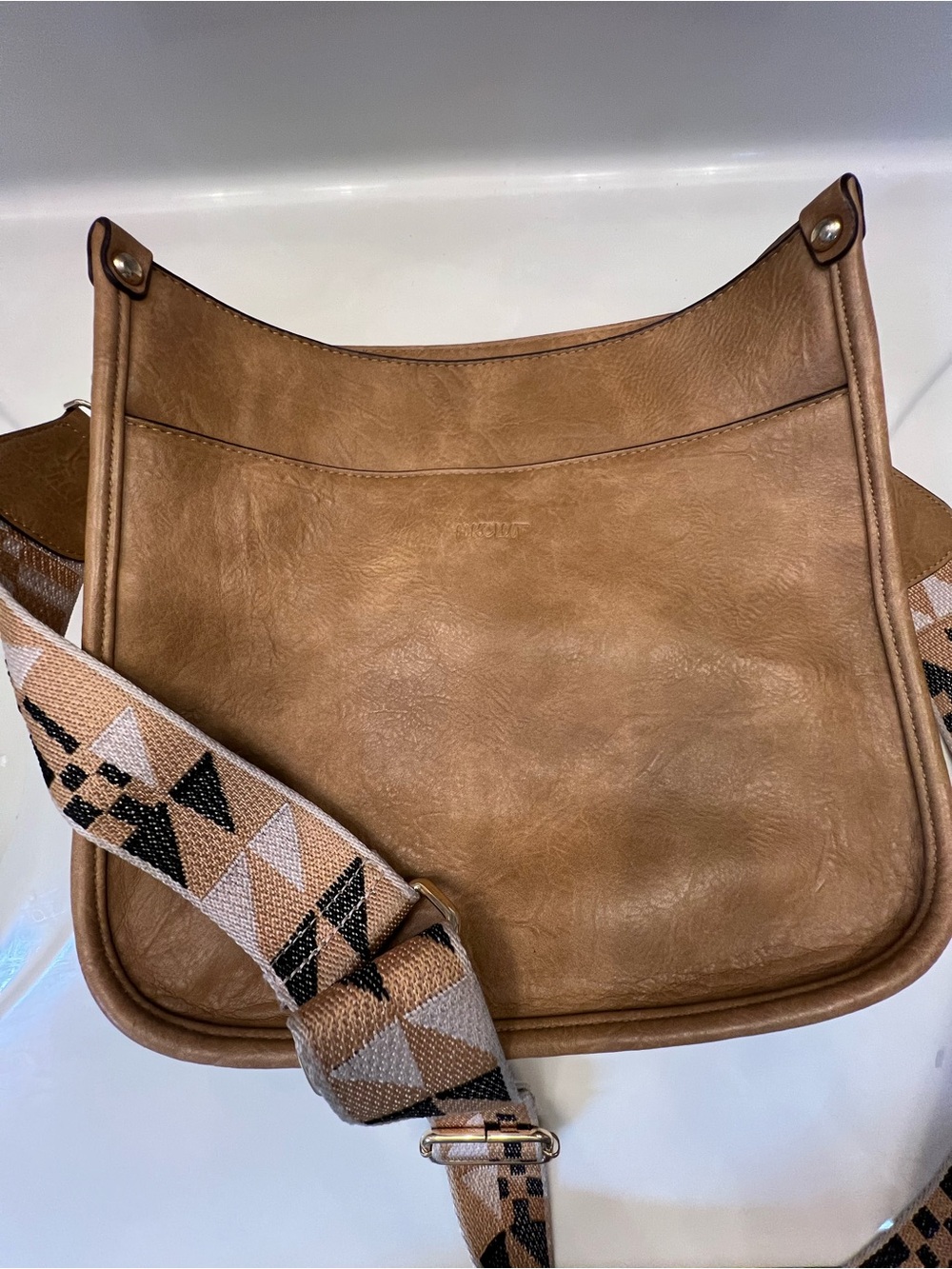 Tan Leather Crossbody Bag with Patterned Strap